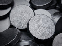 Close-up of 25mm round bases for Warhammer 40k, Age of Sigmar, and other tabletop games