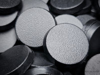Close-up of 25mm round bases for Warhammer 40k, Age of Sigmar, and other tabletop games