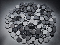 Top view of 25mm round ABS plastic bases for Warhammer miniatures, showing textured finish.
