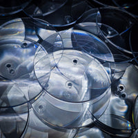 Close-up of 60mm clear round base with centre hole for flying stem, Open Basing System by Hobby Heaven