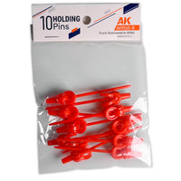 AK Interactive AK9565-B Holding Pins 10 units in clear bag packaging showing red plastic clip-top pins with header card reading 10 Holding Pins Recommended for AK9565