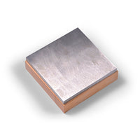 AK Interactive Steel Work Block shown at angle revealing brushed hardened steel flat surface on top of light wooden shock-absorbing base with visible steel-to-wood joint