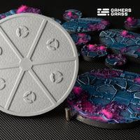 Close-up of 100mm Alien Infestation base showing multiple magnet slots and professional mounting system