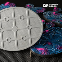 Close-up of 120mm oval Alien Infestation base showing advanced magnet mounting system and reinforced structure