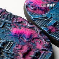 Extreme close-up of 90mm oval Alien Infestation base showing intricate alien landscape and horror elements