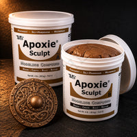 Aves Apoxie Sculpt 4lb Bronze — large Part A and Part B tubs with bronze putty visible, alongside a detailed sculpted ornate shield boss with Celtic knotwork patterns
