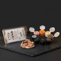 Aves Apoxie Sculpt Earth Colour Kit with open earth-tone sample pods and sculpted terrain sample, showing pink, natural, orange and bronze colours for mixing and modelling