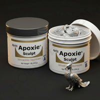 Aves Studio Apoxie Sculpt Silver Grey 1 lb with Part A and Part B jars beside a silver bird sculpture