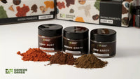 A selection of 3 different colored dry pigments for basing and weathering miniatures.