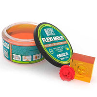 Open container of Green Stuff World Flexi Mold with sample cast mold and product details