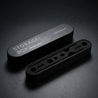 Gaahleri airbrush components storage box satin black tin with foam insert showing slots at studio angle on dark surface