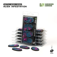 Gamers Grass packaging and four painted 60mm oval Alien Infestation bases displayed on white background