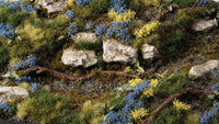 Gamers Grass Bluebeard Flowers Tufts applied on diorama terrain with rocks, shrubs and scenic basing for miniatures