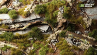 Vibrant green landscape diorama created using the Green Grass Tuft Starter Box, showcasing a lush meadow scene with varied grass tuft