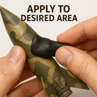 Applying HHP-1001 camouflage putty to model rocket surface – hands-on masking process before painting
