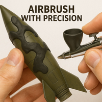 Airbrushing over applied elastic masking putty on model – precision masking with HHP-1001 in action