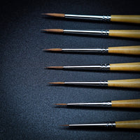 Series 4 Kolinsky Sable brush tips and ferrules close-up — sizes compared side by side showing point quality