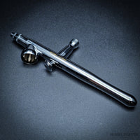 Close-up of Iwata Revolution BR airbrush 0.3 mm on dark background