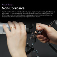 Kaleido airbrush cleaner in use showing hands flushing airbrush with non-corrosive water-based cleaner