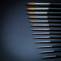 Close-up macro detail of Kolinsky Sable brush tips showing perfect fine points and natural hair taper, Series 33 Rosemary & Co watercolor brushes demonstrating premium quality and precision