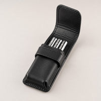 Open Rosemary & Co 3 pocket leather brush wallet showing short travel brushes stored in individual pockets
