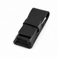 Closed Rosemary & Co black leather travel brush wallet with fold-over flap and tuck strap