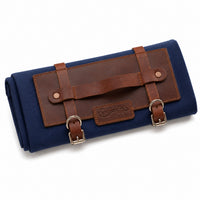 Closed Rosemary & Co short handle brush wrap with navy canvas, full-grain leather front panel, carry handle and metal buckle straps