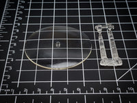 Close-up of 60mm flying base showing crystal-clear acrylic material