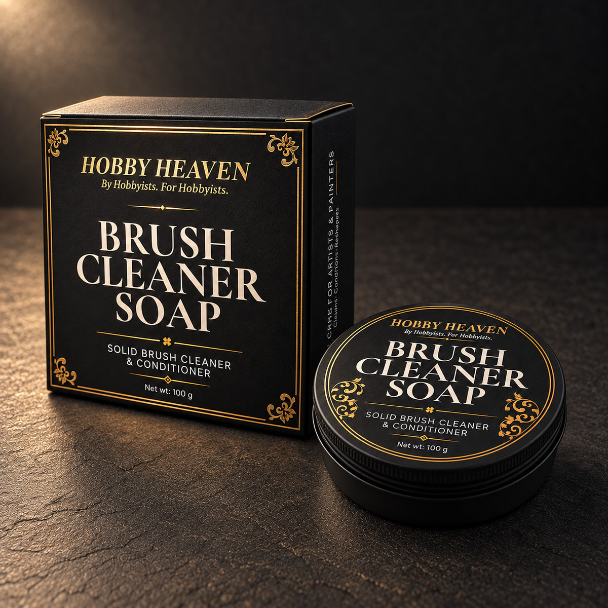 Brush Cleaner Soap box with gold-foil border beside the closed black screw-top tin