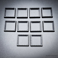 Ten base converters 20mm to 25mm square displayed in group on dark surface
