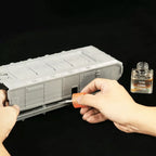 Slow Curing Cement applied with the cap applicator along a joint on a large grey plastic kit hull