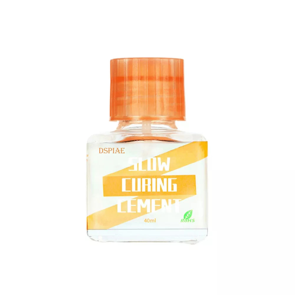 DSPIAE Slow Curing Cement 40 ml bottle with orange cap, label facing forward, on white