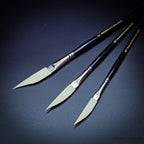 Three Rosemary & Co Ivory synthetic sword liner brushes fanned out, sizes 1/4, 3/8 and 1/2 inch, showing the long tapering dagger heads