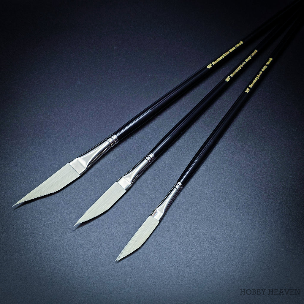 Three Rosemary & Co Ivory sword liner brushes laid diagonally with gold-printed black handles, sizes 1/4 to 1/2 inch
