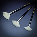 Three Rosemary & Co Ivory synthetic fan brushes fanned out, sizes 2, 4 and 6, showing the flat ferrule and spread cream bristles