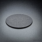 Single 60x35mm oval plain plastic base in matte black, angled to show its fine textured top face