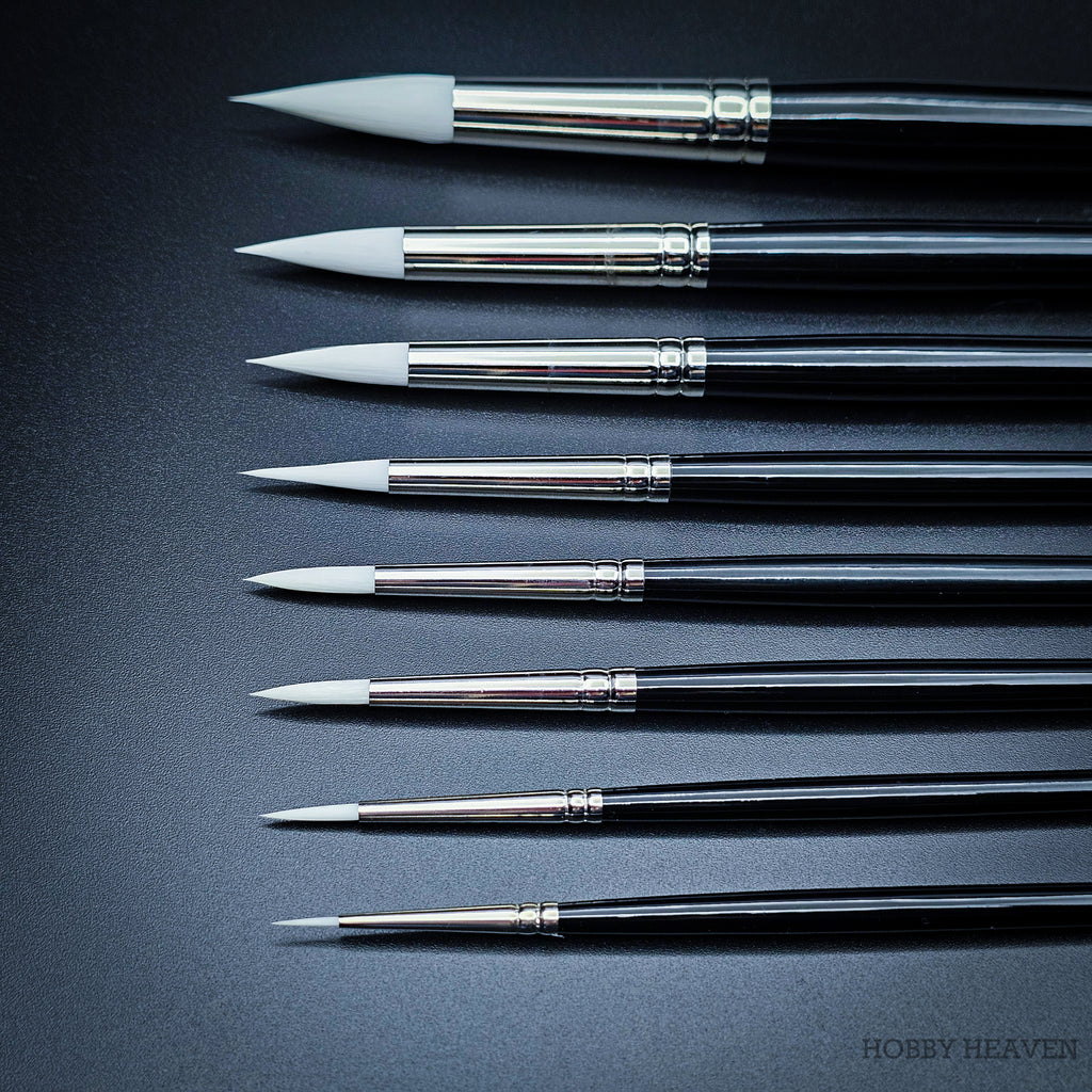 All nine Snowdrop sizes arranged showing brush heads from the side, comparing the progressive tuft width from size 0 to 16