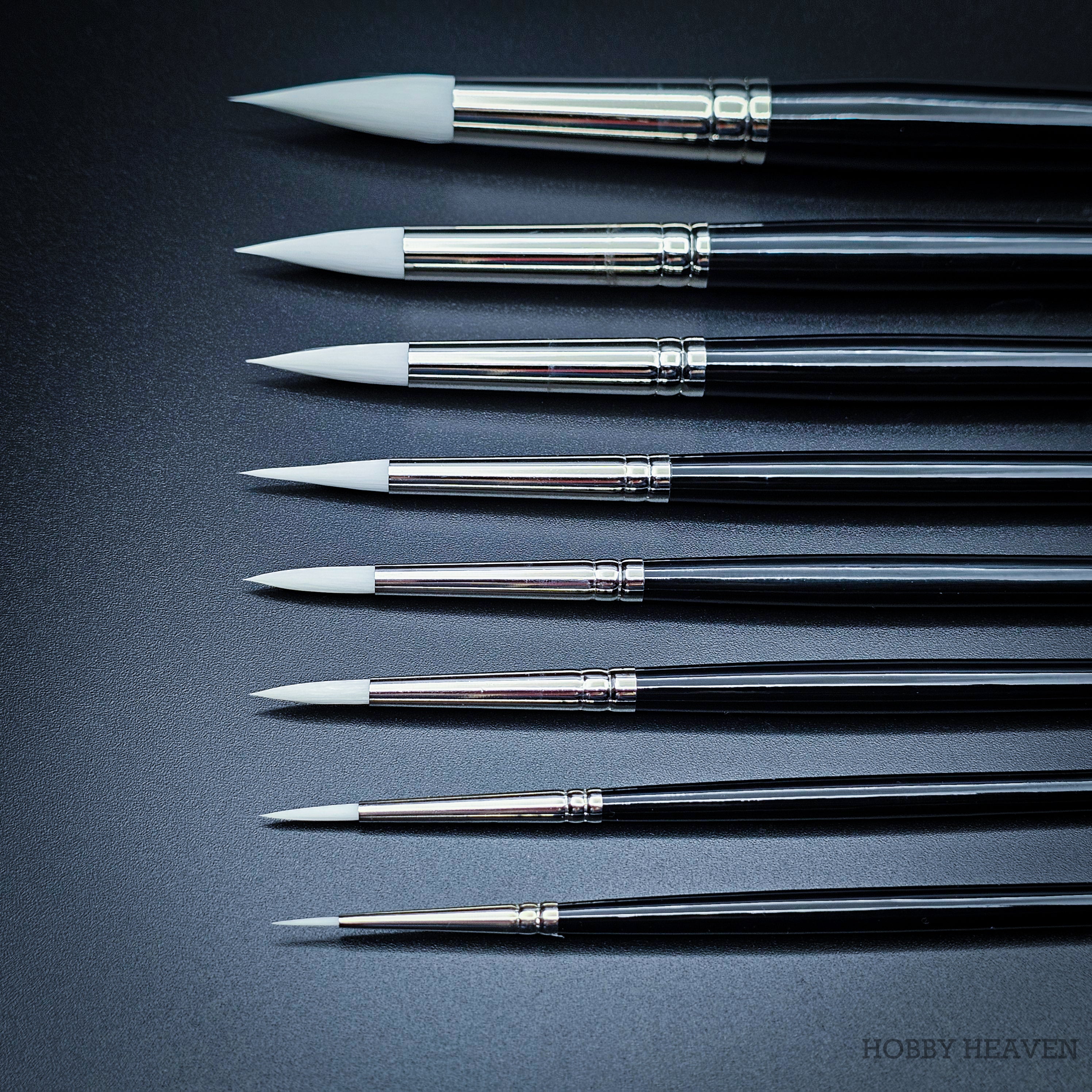 All nine Snowdrop sizes arranged showing brush heads from the side, comparing the progressive tuft width from size 0 to 16