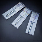 Three Pocket Kolinsky brushes in sealed packaging viewed from above showing the closed chrome handles