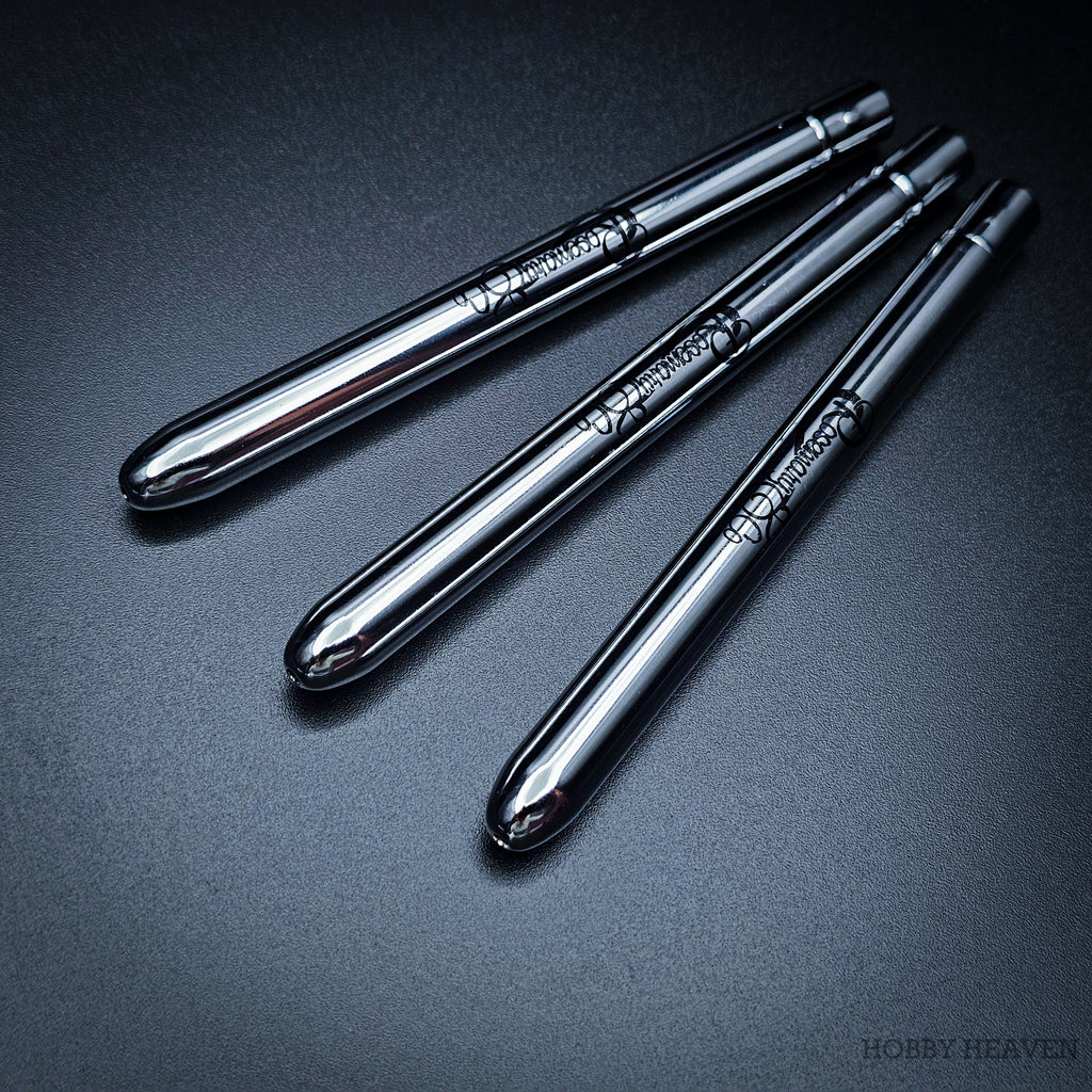 Three Pocket brushes closed with protective caps, showing polished chrome handles with Rosemary & Co engraving