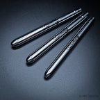 Three Pocket brushes closed with protective caps, showing polished chrome handles with Rosemary & Co engraving