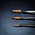 Close-up of three Kolinsky sable brush heads in sizes 4, 6 and 8 showing naturally tapered pointed round tips