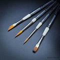 Set 35 Travel Brush Essentials — four pocket brushes open showing R12 dagger, R1 Kolinsky pointed round, R13 sable blend designer and R20 Red Dot flat