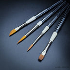 Set 35 Travel Brush Essentials — four pocket brushes open showing R12 dagger, R1 Kolinsky pointed round, R13 sable blend designer and R20 Red Dot flat