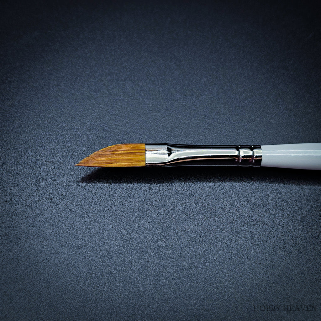 Close-up of R12 dagger brush head showing the angled sable-nylon blade with chrome ferrule