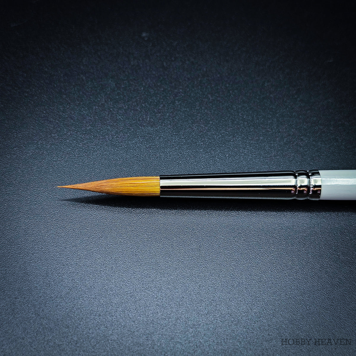 Close-up of R13 sable blend designer pointed brush head showing the tapered golden-toned fibre