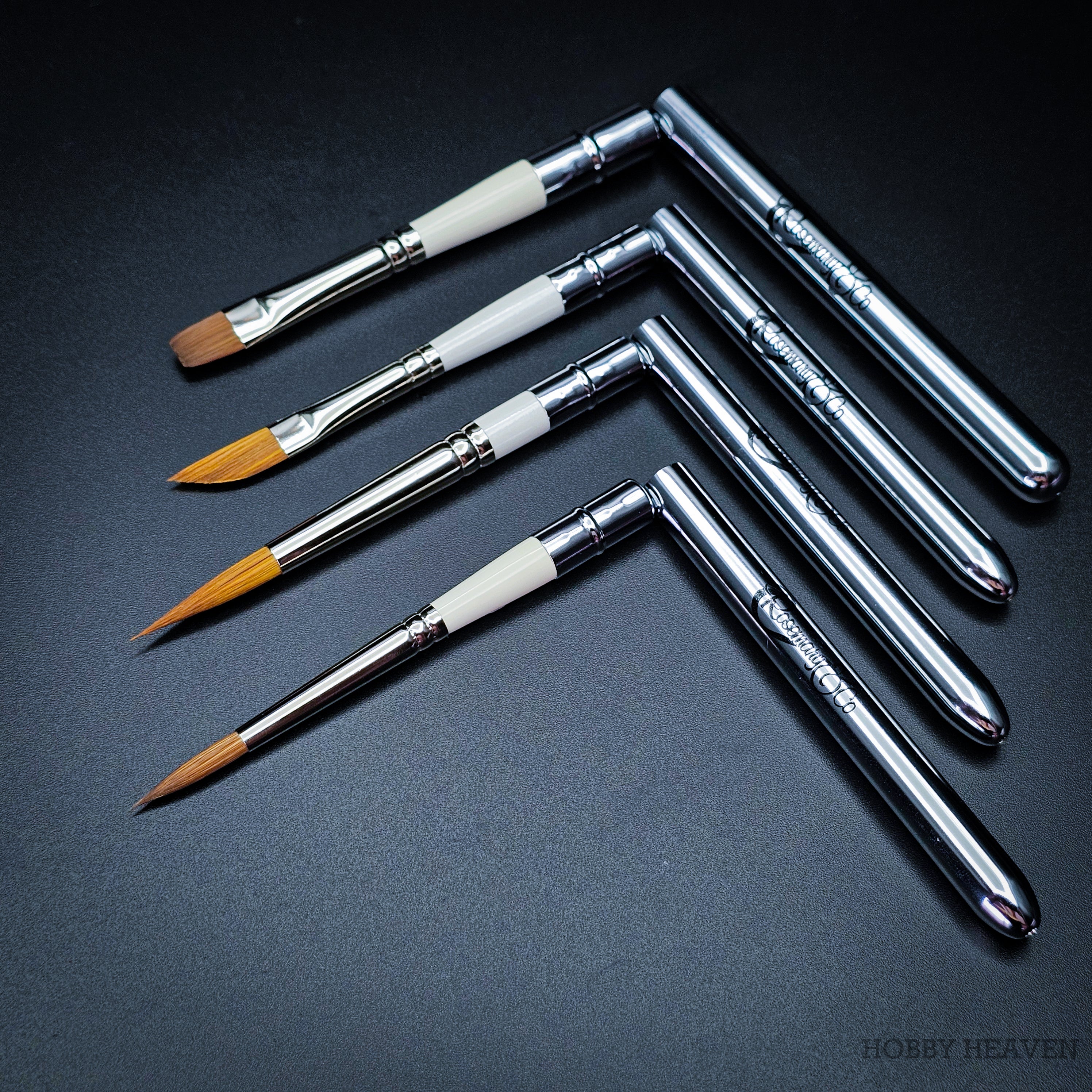 Four Set 35 pocket brushes arranged with handles open at right angles showing all four head shapes and Rosemary & Co branding