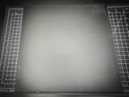 Top-down photograph of the 300mm square smooth PLA base on a cutting mat, showing the clean matte surface with subtle FDM layer lines.