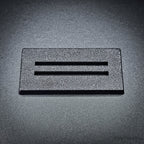 Single black 50x25mm rectangle slotted base, two parallel slots centred along the length