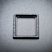 Single 20mm to 25mm square base converter on black background showing detail

